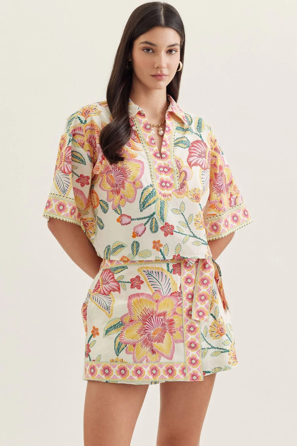 The Isla Floral Top in vibrant botanical print on cream